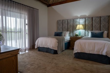 Twin-bed guest room with garden view at Tolile Lodge